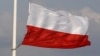 Poland - A Polish national flag is at half mast in front of the stage for a commemoration ceremony for the plane crash victims at the Pilsudski square in Warsaw, 16Apr2010