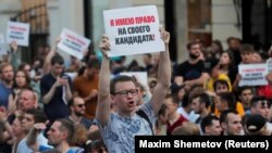 Участники акции протеста, требующие регистрации оппозиционных кандидатов на выборах в Мосгордуму. Июль 2019 года. Фото: Reuters